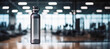 A single water bottle with condensation in a gym setting the concept of hydration 