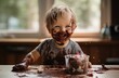 Joyful Child with Chocolate on Face and Hands