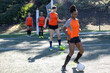 © Mat Hayward - Group of five female soccer players on a team warming up and running calisthenics during practice exercise for the sport.