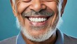 cropped smile of an elderly man with a gray beard and perfect teeth and a macro zoom of a collage of an implanted tooth in the gum on a blue background with copy space dentistry concept prosthetics