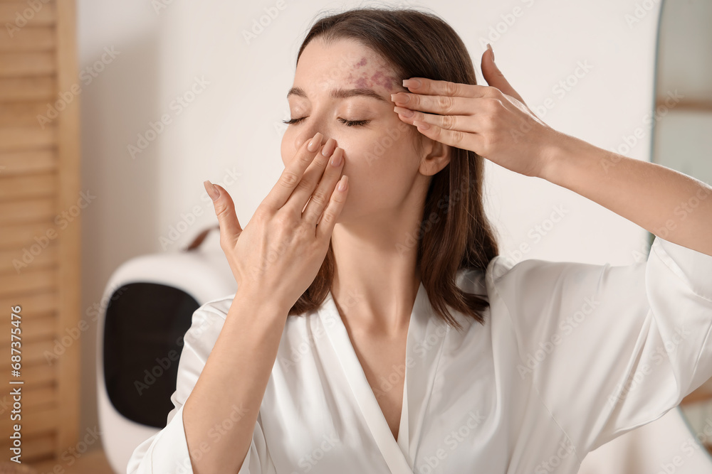 Young woman doing face building exercise in bathroom, closeup