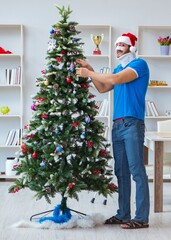 Wall Mural - Injured man celebrating christmas at home