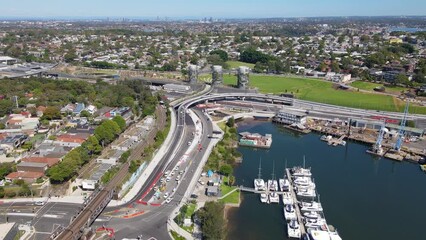 Wall Mural - Aerial drone view of Rozelle Interchange in Sydney, NSW Australia toward the large chimney towers, shot on 3 December 2023 