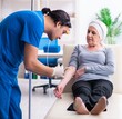 © Elnur - Young male doctor and female oncology patient