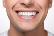 © Cadengo - Healthy perfect teeth, young man smiling. Teeth whitening. Isolated white background