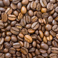 Close up of a bunch of coffee beans background top view; roasted dark brown coffe seeds