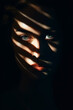 Woman's face with shadow of her face.