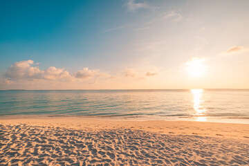 Wall Mural - closeup beach coast sand texture with warm gold orange sunset light. fantasy beach landscape sky sea