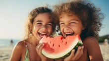 Portrait Of Two Young Girls Enjoying A Watermelon And Laughing Together.