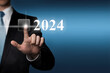 New Year 2024 - finger pressing virtual touchscreen button