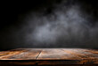 Old wooden table with smoke on dark background