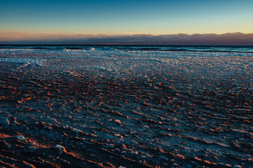 Canvas Print - Ice on lake in cold winter weather at twilight