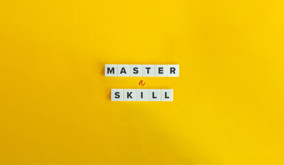 Wall Mural - master a skill phrase on block letter tiles on bright orange background. mastery, practice, training