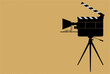 Movie camera cinema projector on a tripod Movie camera cinema projector on a tripod. Film or Movie festival banner, flyer, poster or tickets. Film or Movie festival copy space blank to add text.