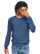 © Krakenimages.com - Young african american man wearing casual winter sweater tired rubbing nose and eyes feeling fatigue and headache. stress and frustration concept.