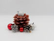 Christmas decoration with pine cones and bubbles on a white background.