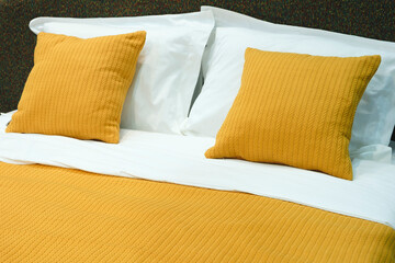 Poster - Interior of a modern bedroom in an apartment, hotel or private house with a bed and pillows