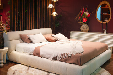 Poster - Interior of a modern bedroom in an apartment, hotel or private house with a bed and pillows
