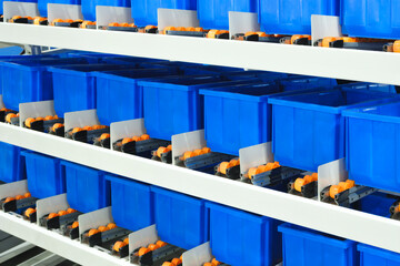 Fototapete - Blue plastic boxes in modern distribution warehouse, logistics concept background