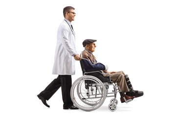Wall Mural - Doctor pushing an elderly injured man in a wheelchair