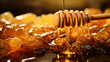 Honey dripping from a wooden honey dipper on a background of honeycombs. 