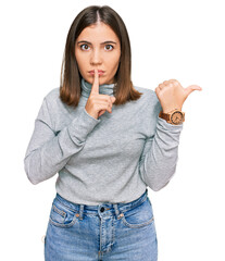 Canvas Print - Young beautiful woman wearing casual turtleneck sweater asking to be quiet with finger on lips pointing with hand to the side. silence and secret concept.