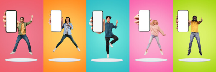 Positive excited young diverse men and women show big smartphone with empty screen