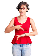 Canvas Print - Beautiful young woman with short hair wearing casual style with sleeveless shirt in hurry pointing to watch time, impatience, upset and angry for deadline delay