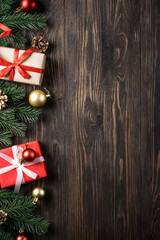 Wall Mural - Christmas presents and holiday decorations on wooden background. Flat lay image.