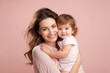 © Imagine - Happy mother's day, brazilian woman, mom and her young girl, smiling together, pink background,