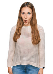 Sticker - Young blonde woman wearing casual clothes afraid and shocked with surprise expression, fear and excited face.