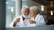 © Andrea Raffin - Senior couple drinking wine happy wearing a white bathrobe.