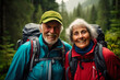 © Dinara - An active elderly couple is traveling through the forest. Mature people enjoying and having fun