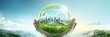 Saving planet concept. Hands holding glass ball with modern city full of green plants against blue sky