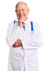 Sticker - Senior handsome grey-haired man wearing doctor coat and stethoscope looking confident at the camera smiling with crossed arms and hand raised on chin. thinking positive.