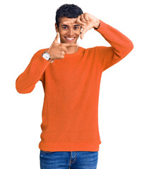 Poster - Young african amercian man wearing casual clothes smiling making frame with hands and fingers with happy face. creativity and photography concept.