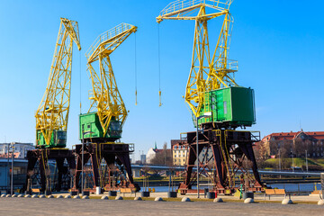 Old cranes on city boulevard in Szczecin, Poland