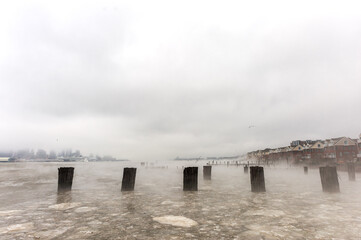 Sticker - Hudson river in Winter with Misty New Your Cityscape in Background.