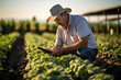 © Gonzalo - farmer using a smartphone app. smart farm concept