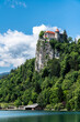 Beautiful view of Lake Bled and Bled Castle above the cliff on a sunny summer day with blue sky cloud, Bled, Slovenia