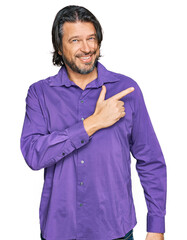 Poster - Middle age handsome man wearing business shirt cheerful with a smile of face pointing with hand and finger up to the side with happy and natural expression on face