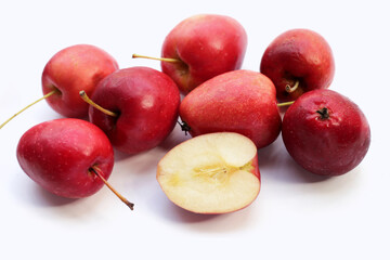 Fresh small red apples on white background