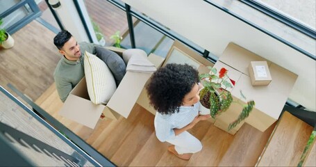 Canvas Print - Couple, new home and boxes for moving, planning interior design and talking of ideas on stairs, property or real estate. Happy interracial people with cardboard, plants and vision for house above