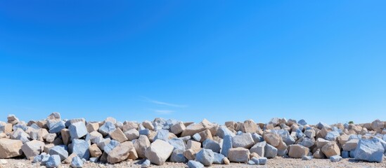 Wall Mural - Construction stones mined under clear blue skies.