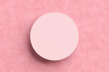 Wall Mural - Top view of an empty circular pink podium or platform on textured pink background.