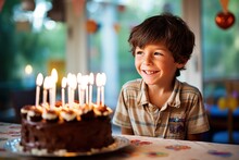 Birthday Boy Blow A Cake In Birthday Party.