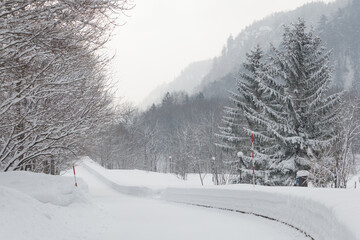 Wall Mural - snowy road in winter countryside landscape