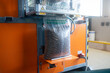 Wood pellet production machine in factory, pellet manufacturing in wood pellet line. Reusing wooden industrial waste.