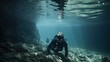 A man swims underwater in the sea in a cave.