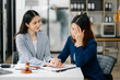 © Nuttapong punna - business people and lawyers discussing contract papers sitting at the table. Concepts of law, advice, legal services.